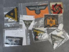 A COLLECITON OF WW2 GERMAN CLOTH BADGES, including army side cap badges, Kriegsmarine chevron,