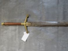 A REPLICA MEDIEVAL TWO HANDED SWORD, turned wood grip, brass pommel and brass cross guard, with
