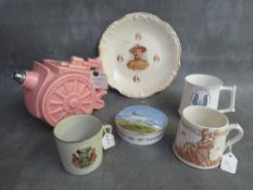 A BOX OF MILITARY INTEREST CERAMICS, to include a cannon teapot, a Dudley peace mug 1919 and a Beden