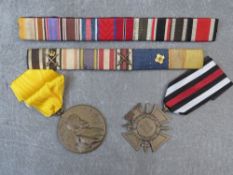 A GERMAN 1914-1918 HONOUR CROSS, Prussia 1847 medal and two bars of German ribbons