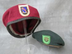 TWO US SPECIAL FORCES BERETS, a dark green example (possibly 10th Div.) and a dark red example (2)