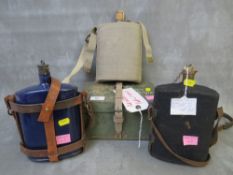 THREE MILITARY ENAMEL WATER BOTTLES, together with a metal ration box (4)