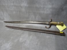A FRENCH 19TH CENTURY CHASSPOT BAYONET, with brass grip, in steel scabbard, L 70.5 cm