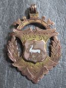 A 9CT GOLD 2ND ROYAL WARWICKSHIRE REGIMENT FOB MEDAL, awarded to Corporal C Kenzitt 1908/9