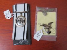 TWO WWI GERMAN EAGLE AN IRON CROSS BADGES, and an iron cross sweetheart pendant brooch (3)