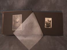 A WW2 MILITARY INTEREST PHOTOGRAPH ALBUM, with general assault badge fixed to front cover, various