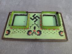 A HAND PAINTED INK STAND, missing bottles, decorated with swastika motif (German / good luck