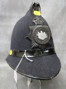 A WW2 ERA MANCHESTER CITY POLICE HELMET, with blackened helmet plate