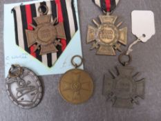 THREE GERMAN 1914-18 CROSS OF HONOUR MEDALS, as war merit medal and a West Wall medal (copy?) (5)