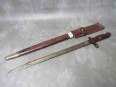 A REMINGTON 1913 BAYONET, with issue mark 3 17, with wooden grooved grip, in scabbard with leather