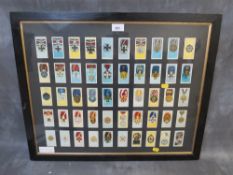 A FRAMED SET OF CIGARETTE CARDS, depicting German WW2 medals and awards, 66 x 55 cm
