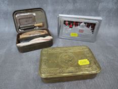 A WW1 1914 PRINCESS MARY GIFT TIN, a WW2 era aluminium cigarette case engraved with a map of