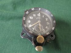 A WW2 GERMAN JUNGHANS AIRCRAFT COCKPIT CLOCK, signed to dial, rotating bezel with front winder and