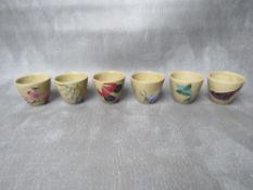 A SET OF SIX MOORCROFT SAKI CUPS, commissioned in 1988 by The ATO Galleries of Tokyo, impressed