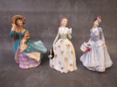 A ROYAL DOULTON 'CAROLYN' FIGURINE HN2112, 'Delphine' figure HN2136 and 'Midinette' figure HN2090 (