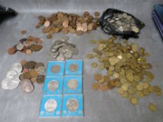 A COLLECTION OF LOOSE COINS, consisting of shillings, brass three pences, half pennies and