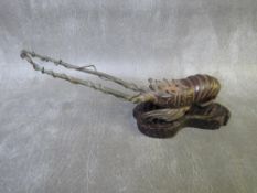 A JAPANESE STYLE BRONZE SPINY LOBSTER, raised on hardwood plinth, H 9 cm, L 20.5 cm