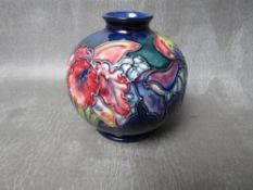 A MOORCROFT 'ORCHID & SPRING FLOWERS' PATTERN GLOBULAR BASE, impressed marks to base, H 11 cm