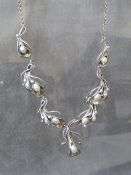 MEREDITH, SCOTLAND - A SILVER AND FRESHWATER PEARL NECKLACE, the pearls in a freeform Art Nouveau
