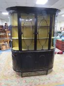 A LATE 19TH CENTURY MAHOGNAY DEMI-LUNE DISPLAY CABIENT, the upper section with two astragel glazed