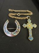 A VICTORIAN CLOISONNE ENAMEL CRUCIFIX ON A CHAIN, together with a horseshoe brooch
