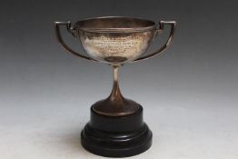 A HALLMARKED SILVER TWIN HANDLED TROPHY ON STAND, Sheffield assay with presentation inscription,