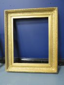 A 19TH CENTURY DECORATIVE GOLD FRAME, frame W 11.5 cm, rebate 69 x 54 cm