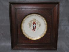 A MINTON PATE-SUR-PATE CABINET PLATE, decorated with a white slip, with cherub emerging from a