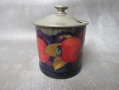A MOORCROFT POMEGRANATE PRESERVE JAR WITH TUDRIC PEWTER COVER, H 10 cm