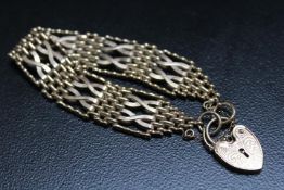 A HALLMARKED 9 CARAT GOLD GATE BRACELET, approx weight 28g