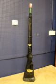 A LARGE NOVELTY BOTTLING OF ITALIAN RED WINE IN THE LIFE SIZE FORM OF A RIFLE, probably Chianti