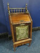 A ROSEWOOD AESTHETIC PURDONIUM, having a brass gallery rail to the top above a hinged door