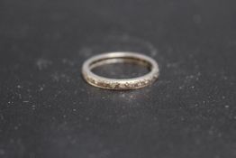 A DIAMOND ETERNITY RING, set in unmarked white metal - possibly platinum, approx weight 3.7g, ring