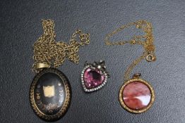 A COLLECTION OF VINTAGE PENDANTS, two bieing on chains stamped 9K, approx combined weight of