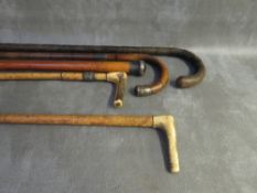 THREE WALKING STICKS, two silver mounted together with two riding crops (5), average L 80 cm