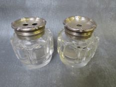 A PAIR OF HALLMARKED SILVER TOPPED GLASS BOTTLES, H 7.5 cm