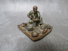 A 19TH CENTURY VIENNESE COLD PAINTED BRONZE FIGURE OF AN EASTERN SHOEMAKER, H 5 cm, base 7 x 6.5 cm