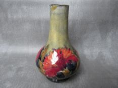 A WILLIAM MOORCROFT SPANISH DESIGN PATTERN VASE, of globular form, marks to the base, H 15.5 cm, S/