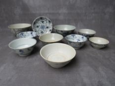 A COLLECTION OF NINE TEK SING CARGO BLUE AND WHITE BOWLS, together with a shallow saucer, all with