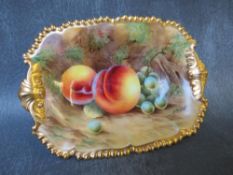 A ROYAL WORCESTER CABINET DISH, decorated by D. Bowker, painted with fruit and gilt decoration,