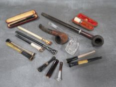 A COLLECTION OF VINTAGE CHEROOT HOLDERS, to include two cased examples, one being amber with a