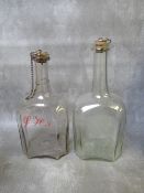 A PAIR OF 18TH CENTURY ENGRAVED ROUNDED SQUARE DECANTERS, one with additional painted initials, with