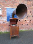AN EXPERT SENIOR E.M. GINN GRAMAPHONE, floor standing in a mahogany case, with a large papier
