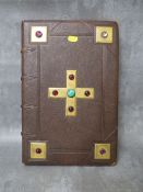 A VINTAGE LEATHER BOUND ALTAR SERVICE BOOK LONDON 1867, with gilt metal panels to the front cover