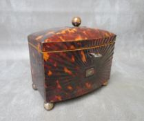 A GEORGE III BOW-FRONTED TORTOISESHELL TEA CADDY, raised on four bun feet, the hinged lid with