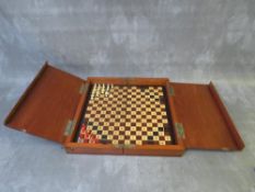 AN EDWARDIAN MAHOGANY TRAVELLING CHESS BOX, with some pieces included, L 30 cm, W 15 cm, D 7 cm