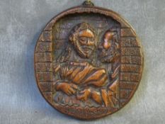 A 19TH CENTURY CARVED WOODEN ROUNDEL DEPICTING CHRIST, Dia. 15 cm