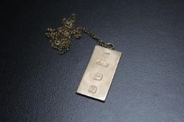 A HALLMARKED 9 CARAT GOLD INGOT STYLE PENDANT, on a 9ct chain, approx combined weight 38.9 g, H 5