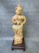 AN EARLY TANG DYNASTY TERRACOTTA FIGURE WITH STAND, figure H 41 cm, overall H 49 cm