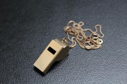 A NOVELTY HALLMARKED 9 CARAT GOLD PENDANT IN THE FORM OF A WHISTLE, on a 9 ct gold chain, approx